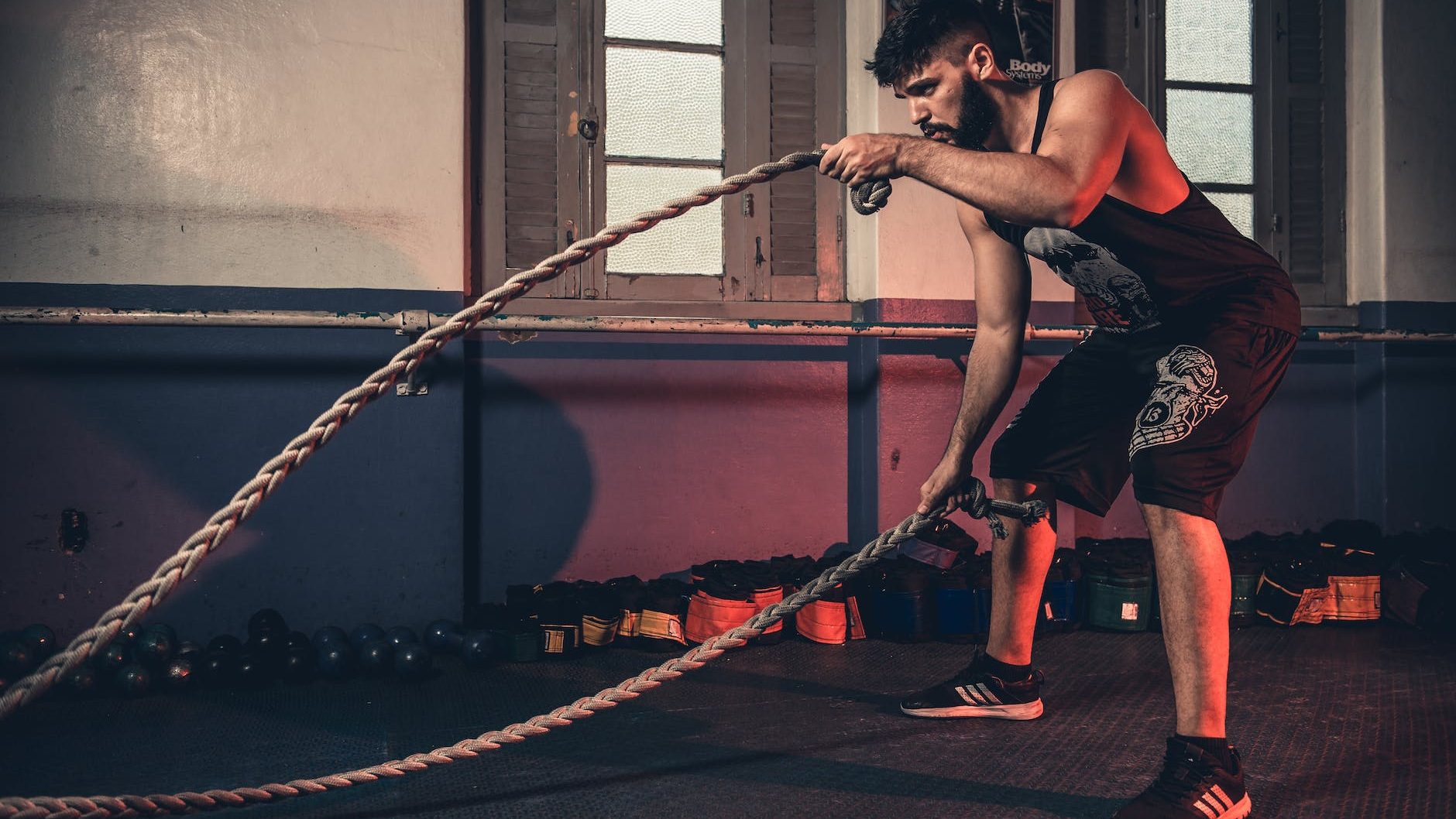 man holding brown rope